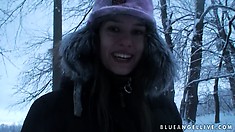 Fine european babe takes a walk through the woods during winter